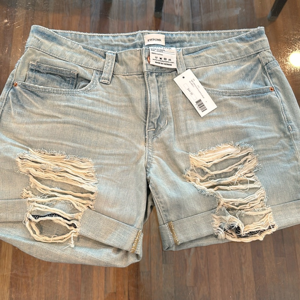 Women’s sneak peek ripped style Jean shorts. NWT.
